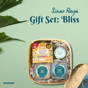 Sinar Raya Gift Box: Bliss - Belgian dark chocolate, Danish cookies, ylang-ylang & grapefruit candle, Rhymba Hills herbal tea, and personalized bamboo box.